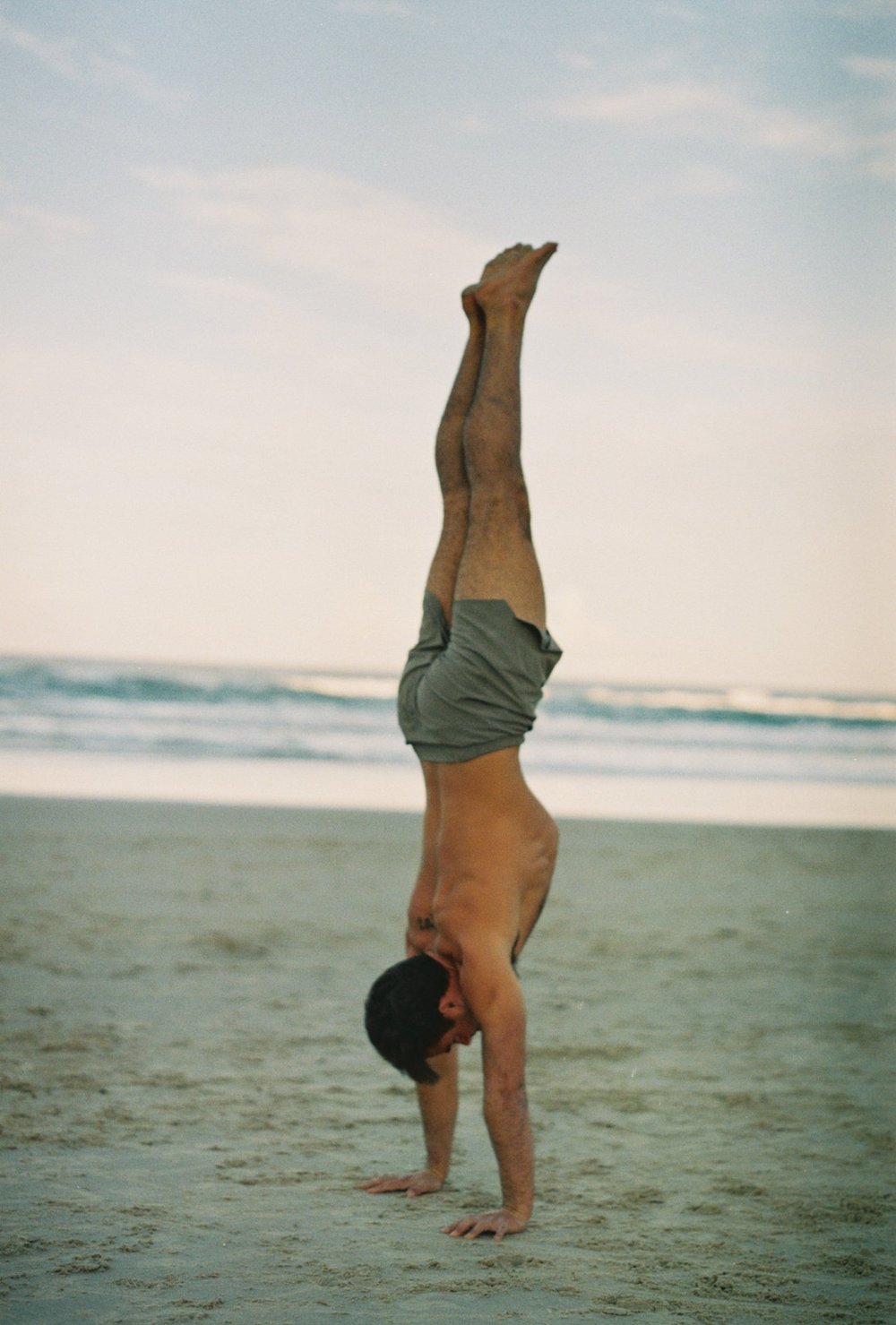 Jayce handstand on beach