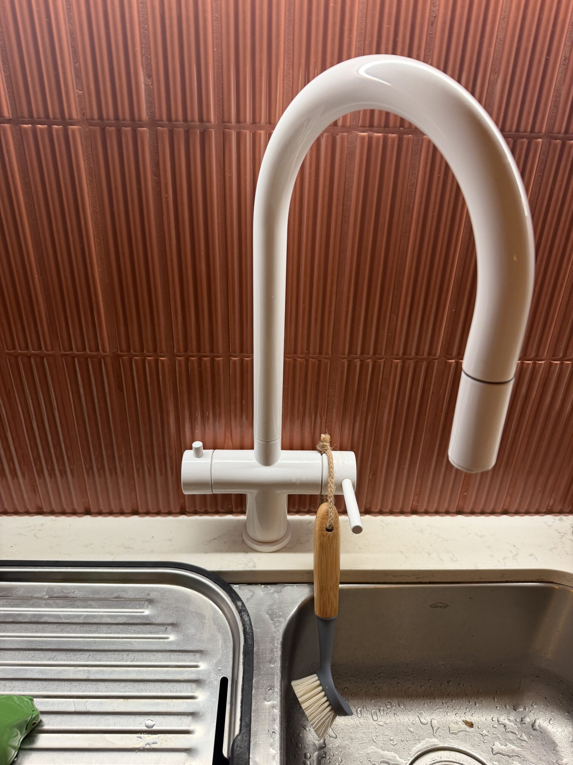EcoHero 5 dedicated RO faucet installed alongside main mixer tap at Palm Beach QLD kitchen