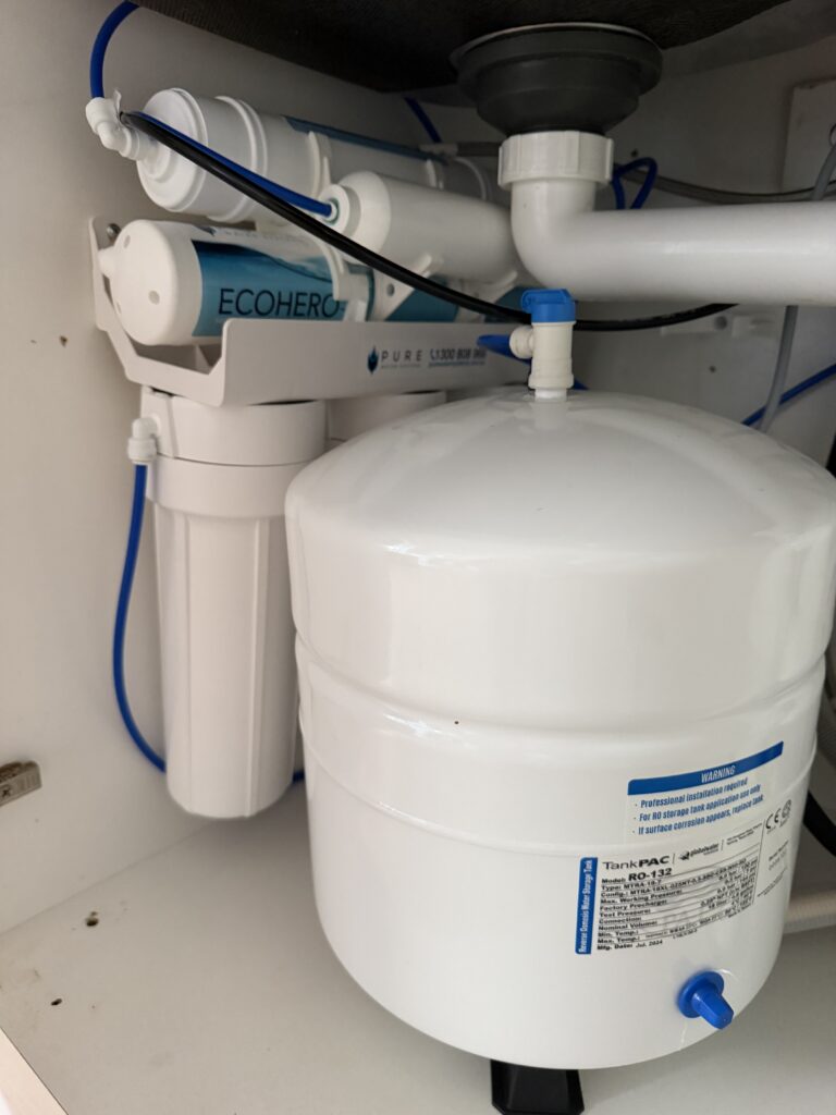 Pure Water Systems EcoHero 5-stage reverse osmosis system under the kitchen sink in Jayce Love's Palm Beach home