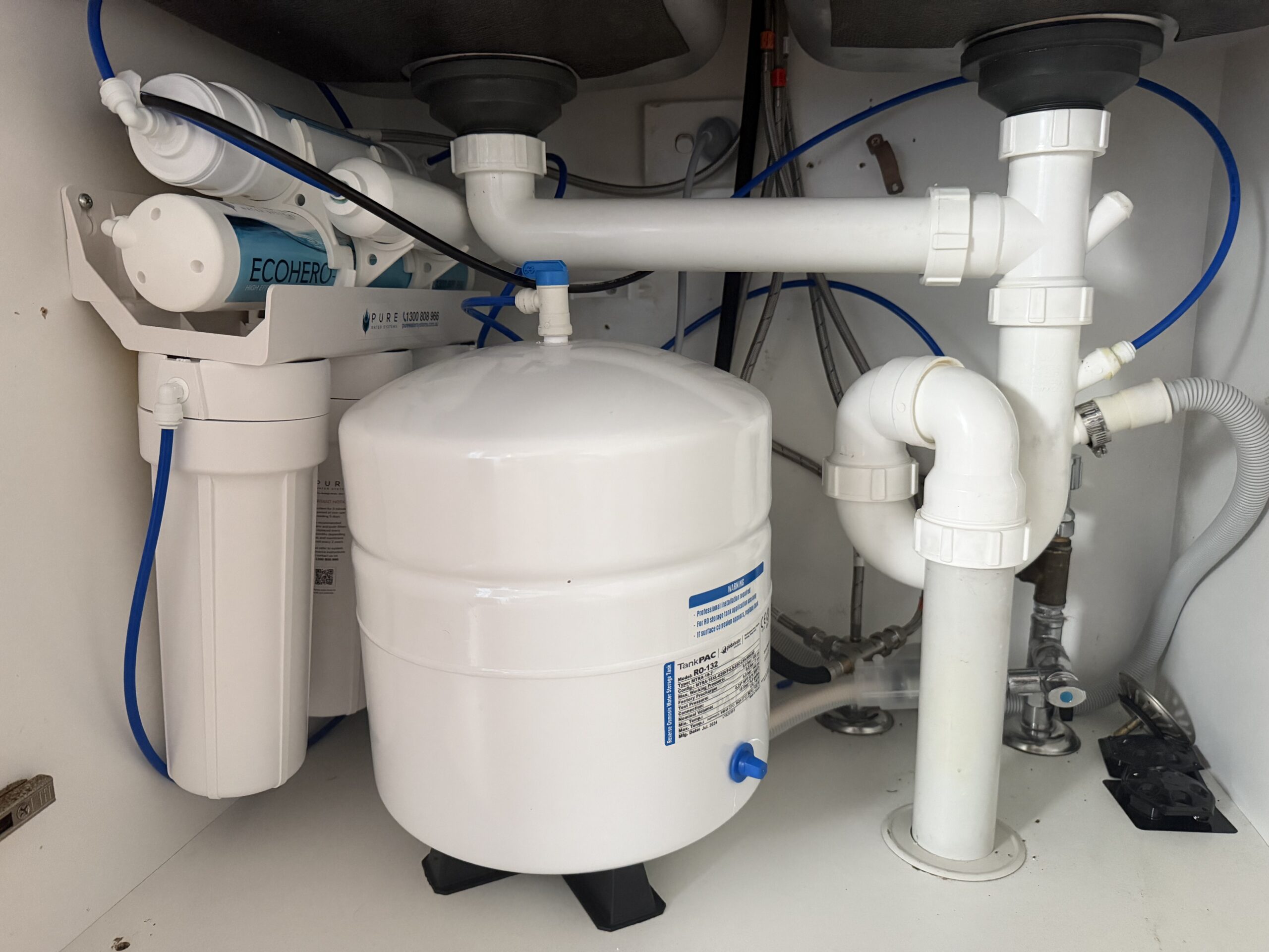 EcoHero 5-Stage RO under-sink installation at Palm Beach QLD -- filter stages, pressurised storage tank, and waste lines