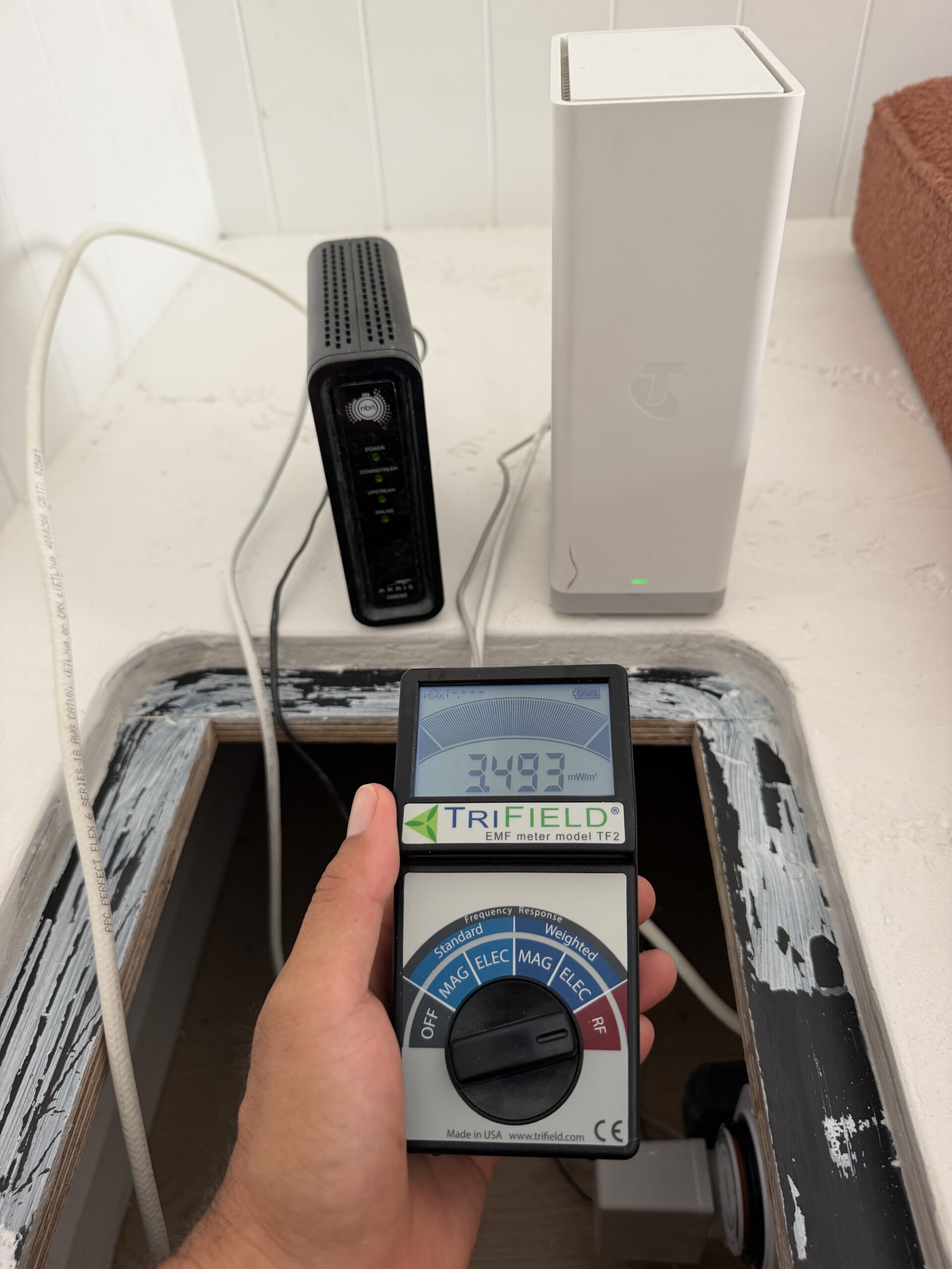 TriField TF2 EMF meter reading 3.058 mW/m² at Palm Beach QLD home Wi-Fi router