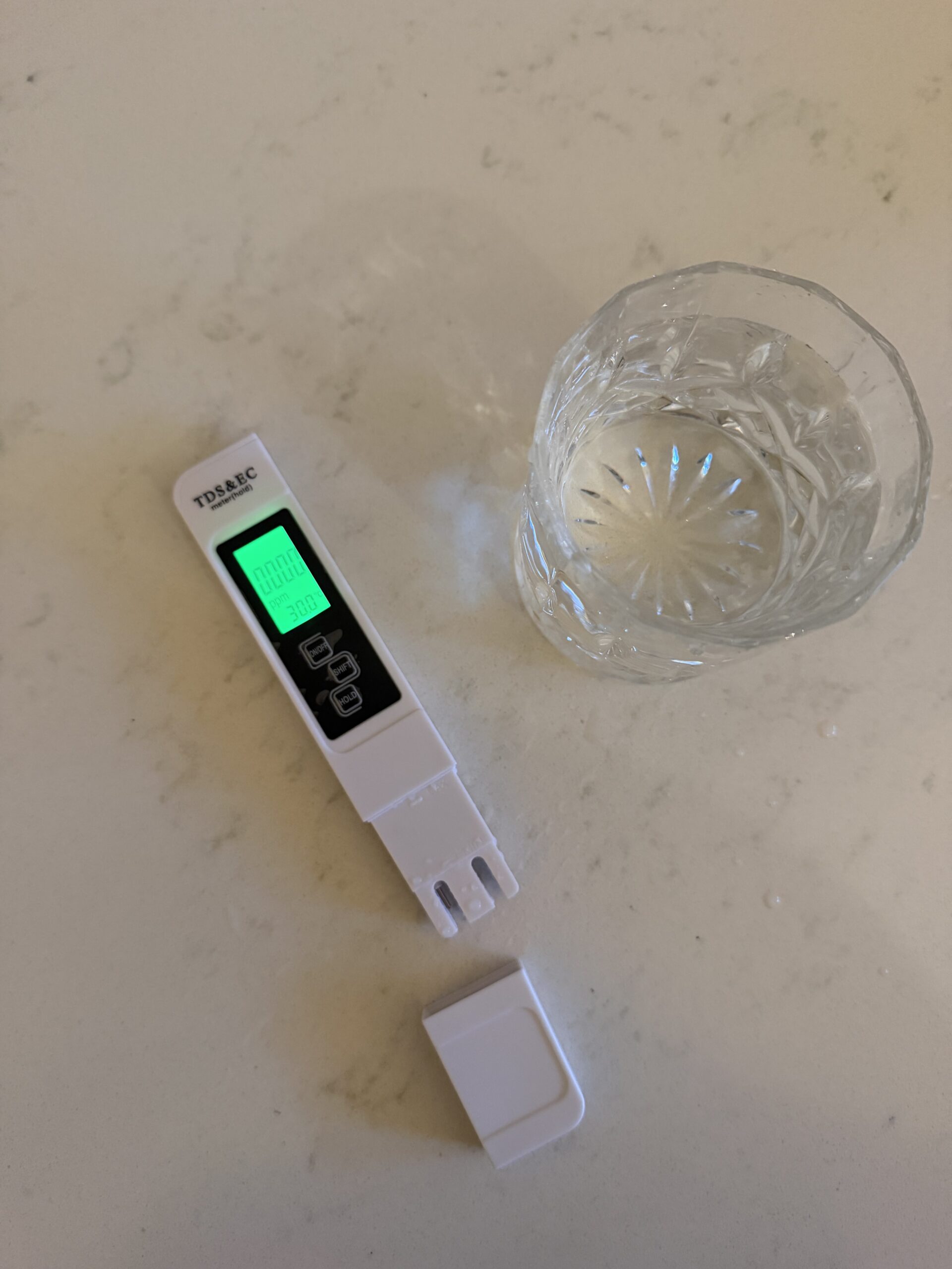 HM Digital TDS meter showing tap vs filtered water test, Palm Beach QLD