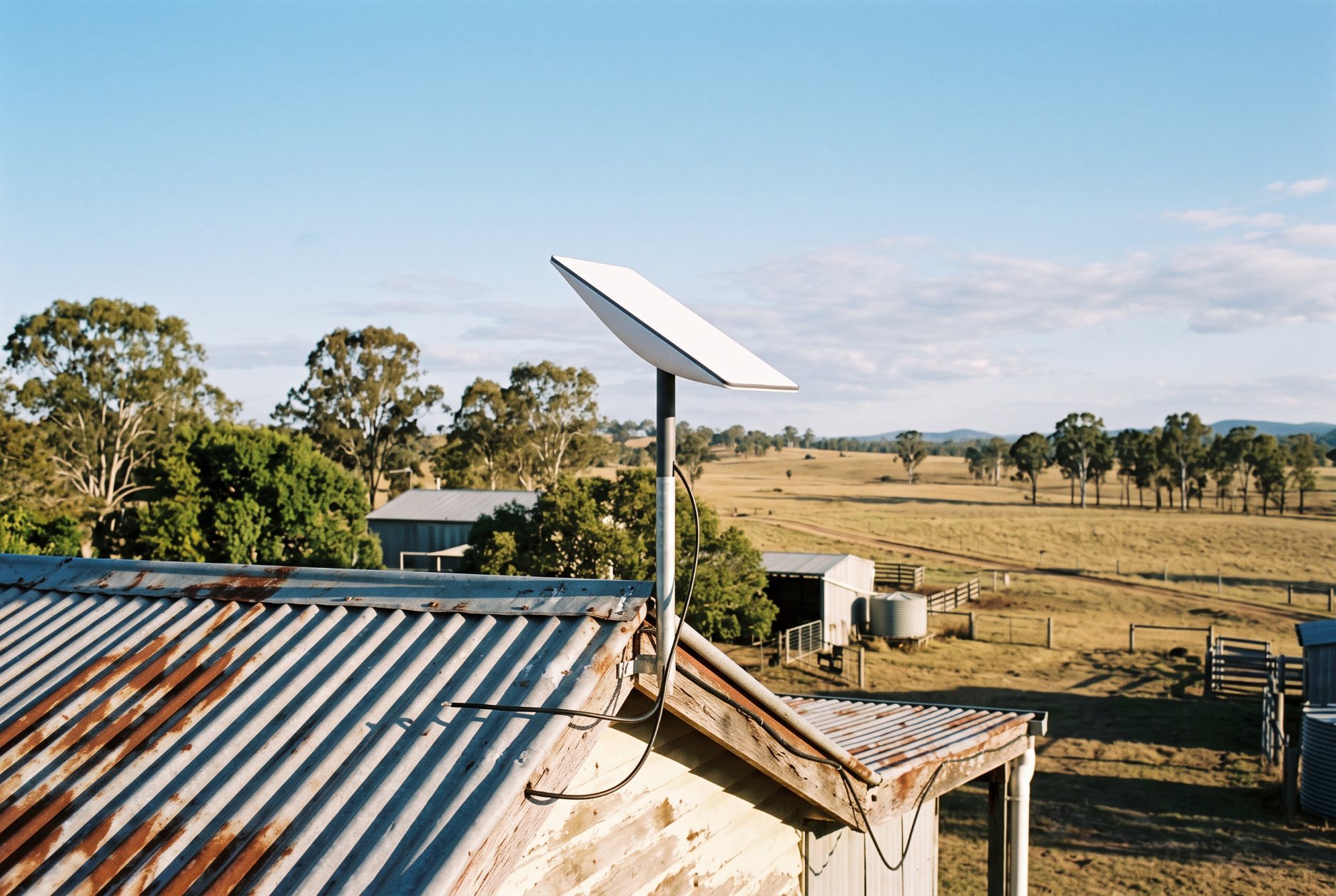 Satellite internet dish on the roof of a rural Queensland farmhouse, illustrating Starlink EMF exposure in Australia